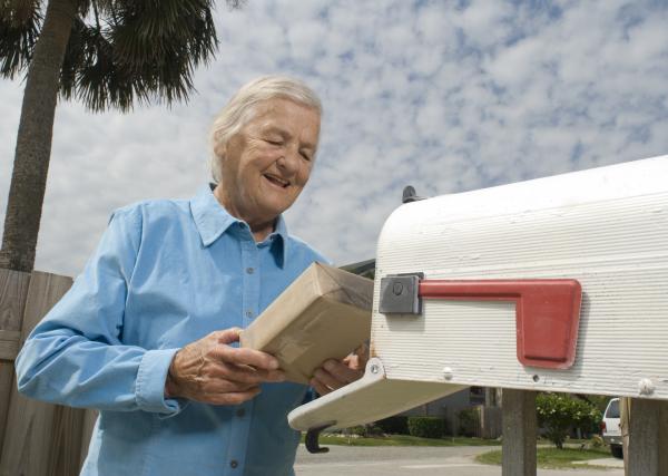 Older man holding a package